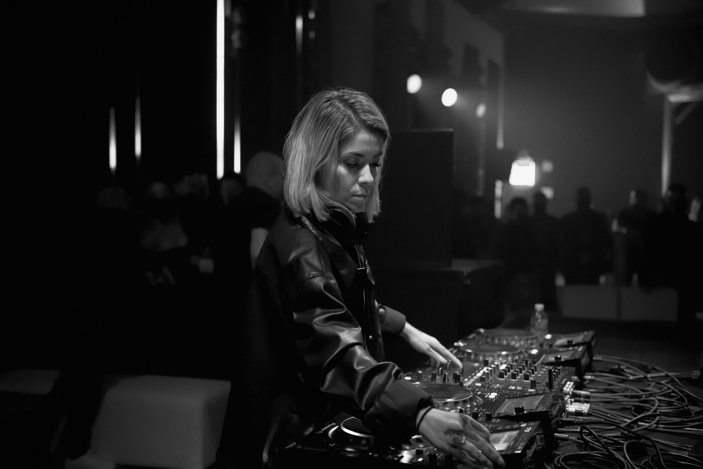 Female Dj using a DJ mixer
